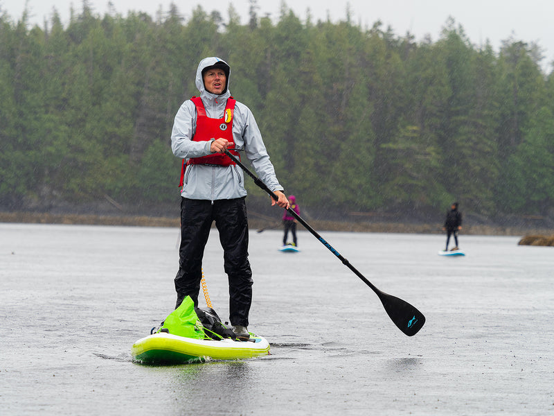 norm hann on a stand up paddle board