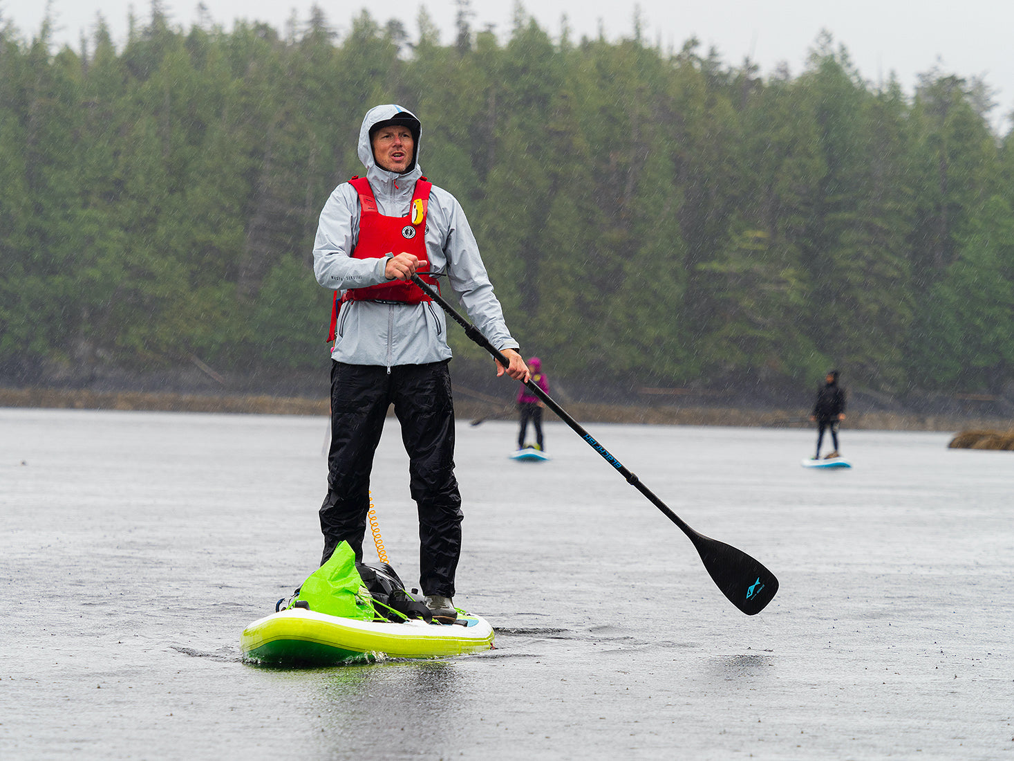 norm hann on a stand up paddle board