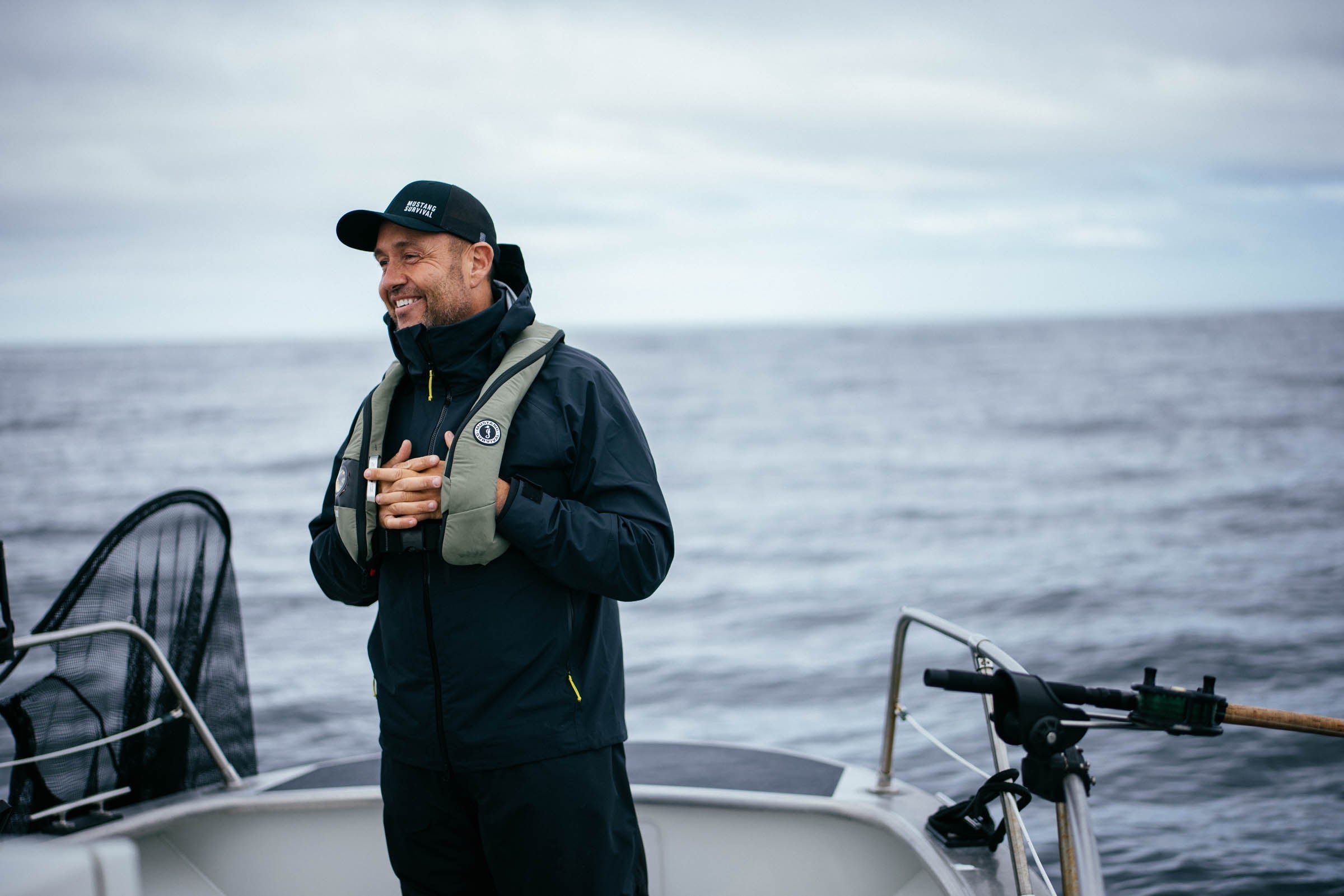 Yos Gladstone salmon fishing guiding in Haida Gwaii at Langara Island Lodge wearing the Elite 120 PFD onboard a boat