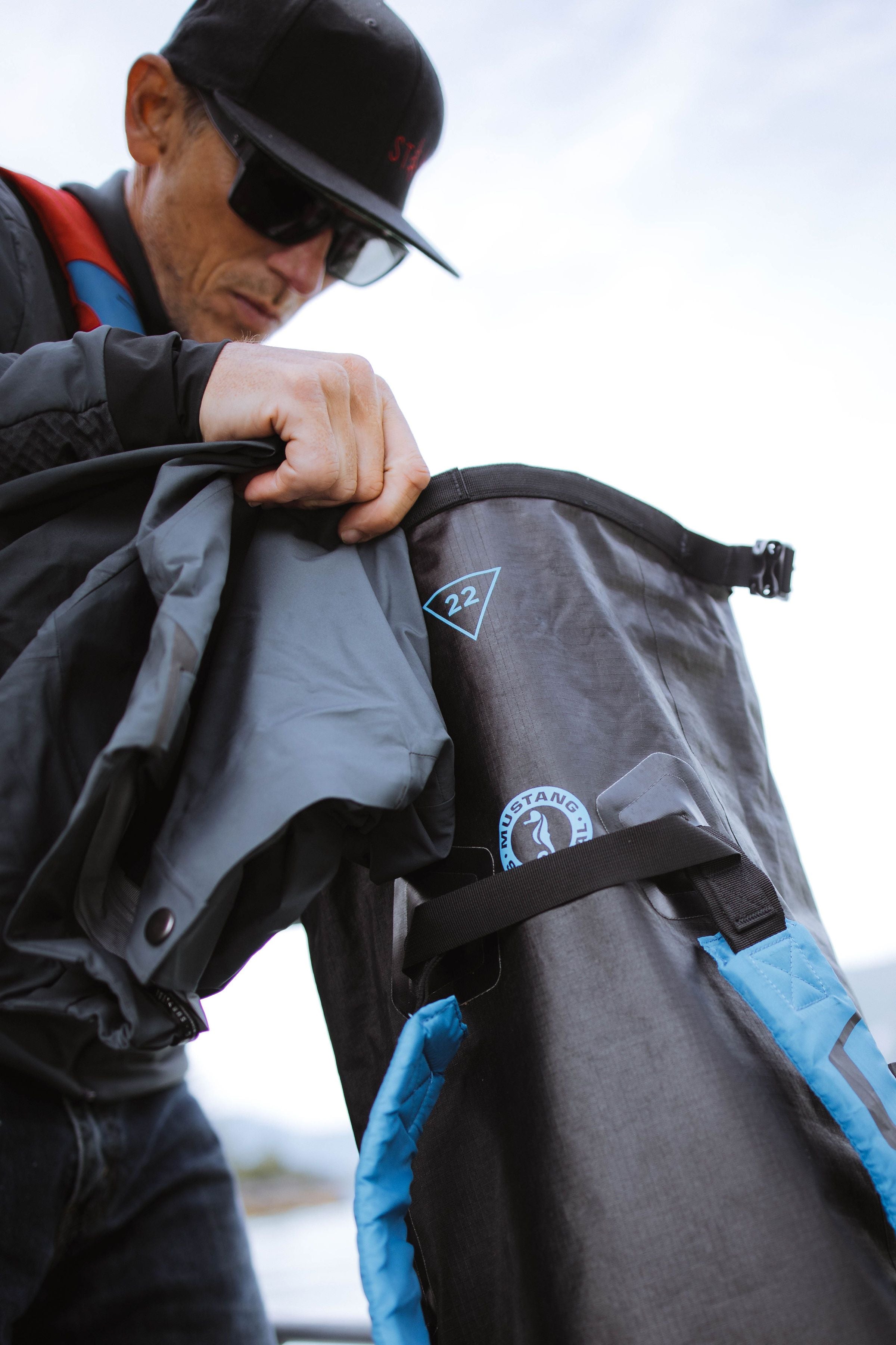 Norm Hann packing a mustang survival dry bag