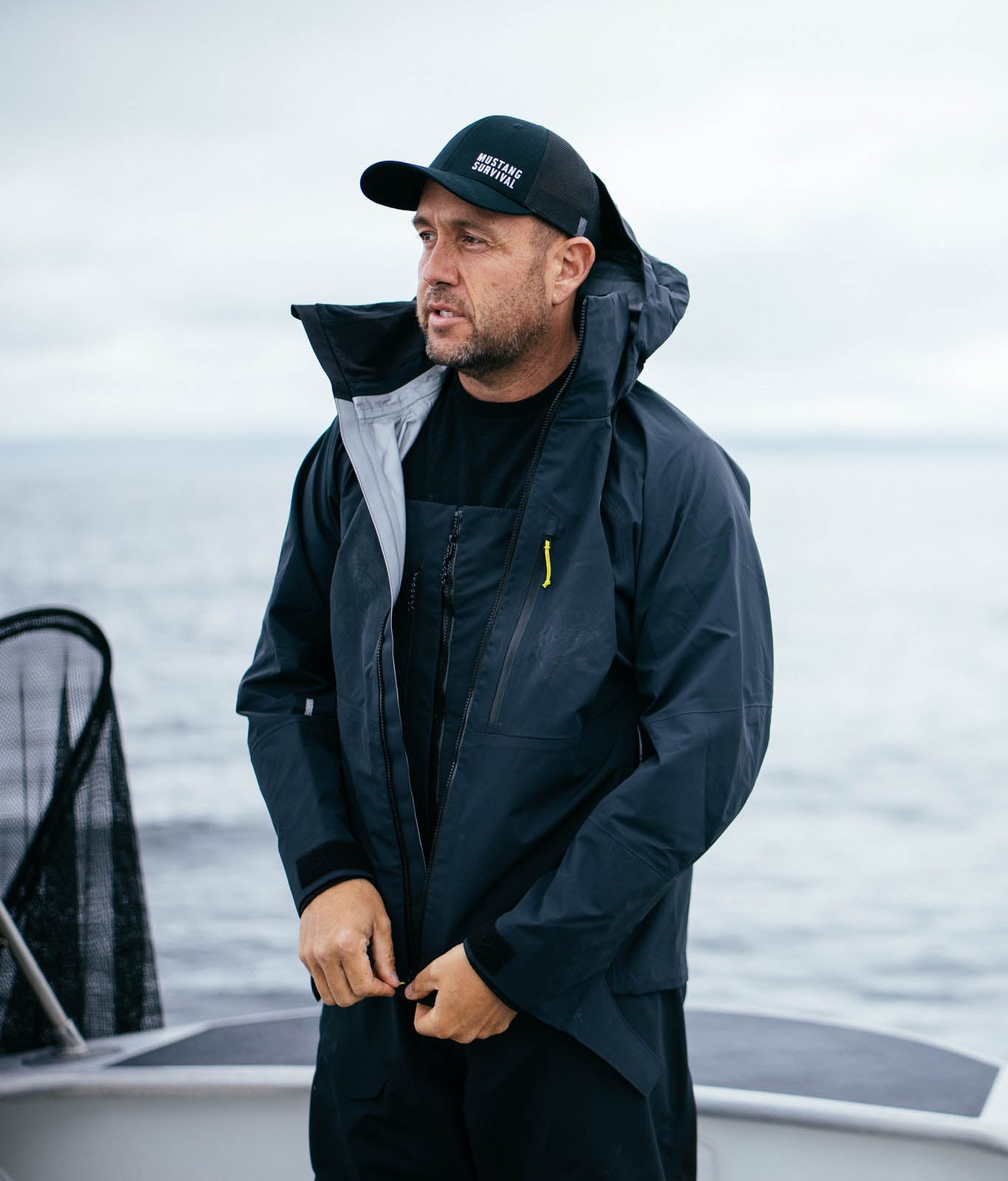Guide wearing taku jacket on a boat